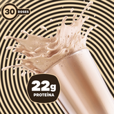 Shake de BOLD Whey sabor Milkshake de Baunilha com efeito de splash sobre fundo listrado bege